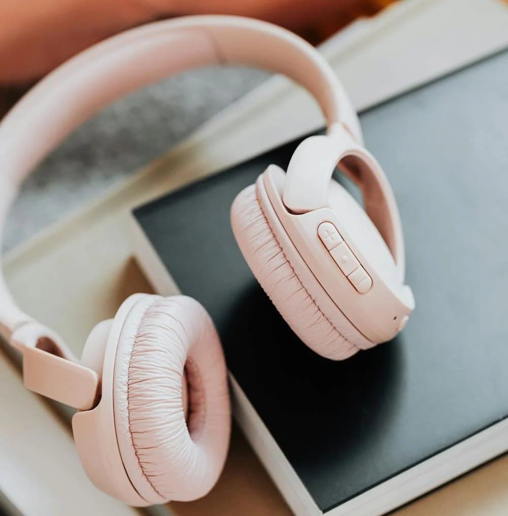 Pink headphones on a desk