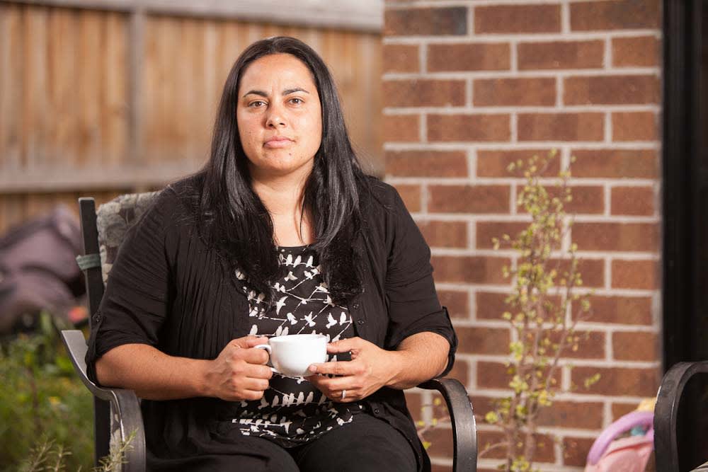 Woman in chair outside having a cuppa