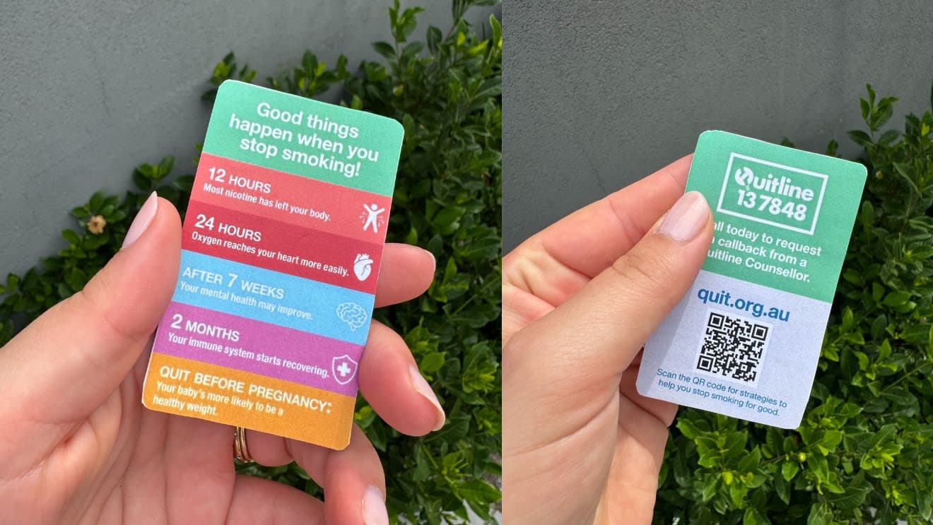 A hand holding the benefits of quitting insert