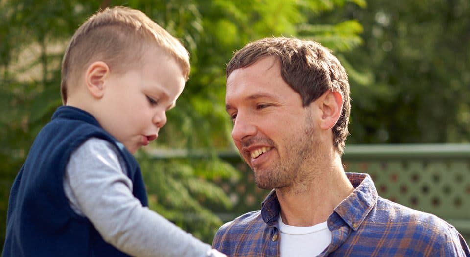 A father looks at his son